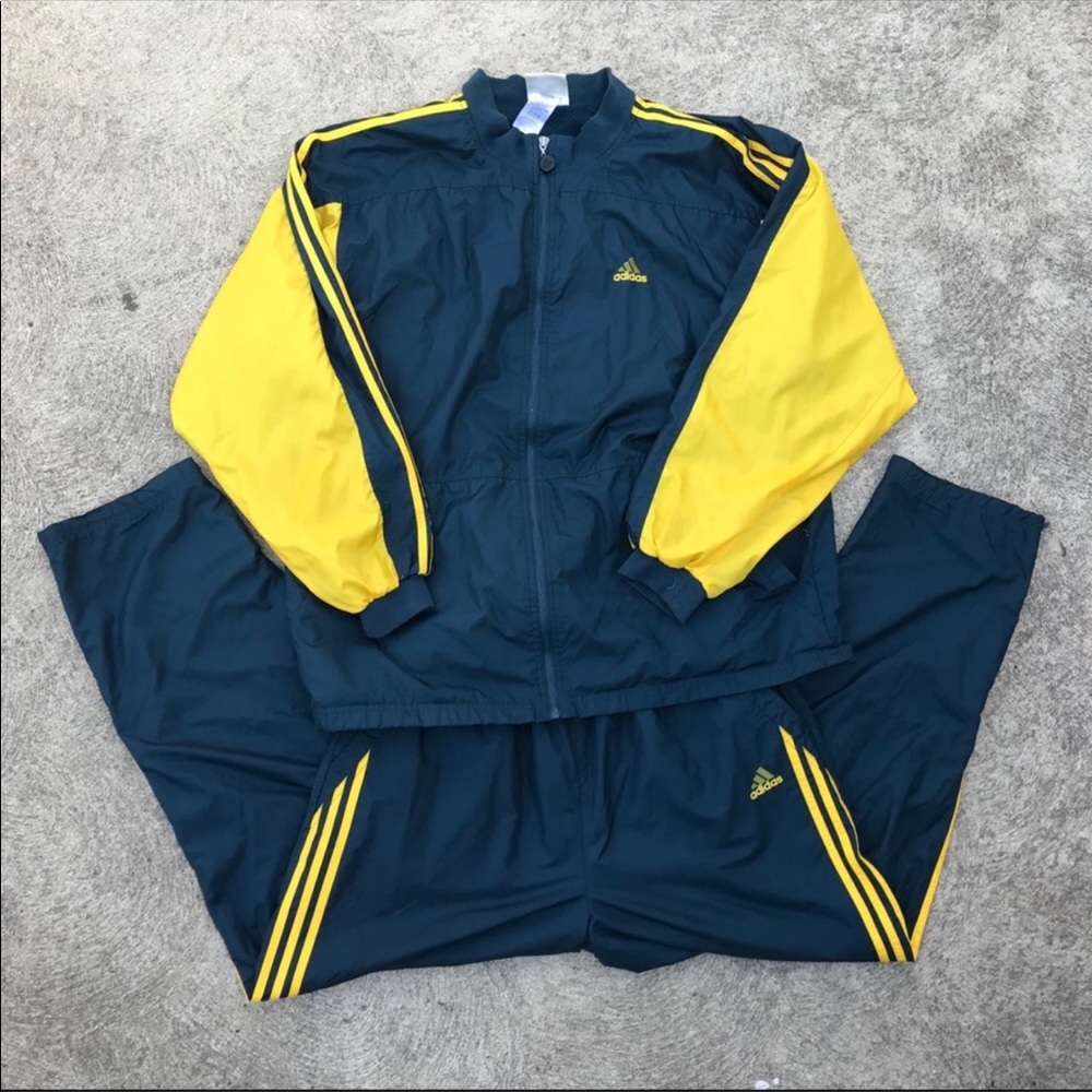 Men’s Adidas 3 stripe track suit.
